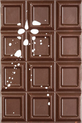 Chocolate tile with milk splashes