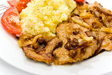 Steak vom Schweinefleisch-geröstet auf Zwiebeln