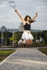 Young brunnete girl with tennis wear