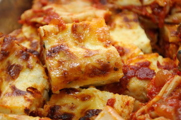 Piece of Lasagna in a pan