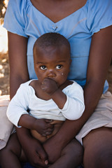 Portrait of African child and mother in the hut,
