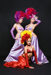 beautiful trio against dark background