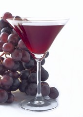 glass of red wine and bunch grapes