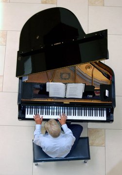 Overhead View of a Piano Player