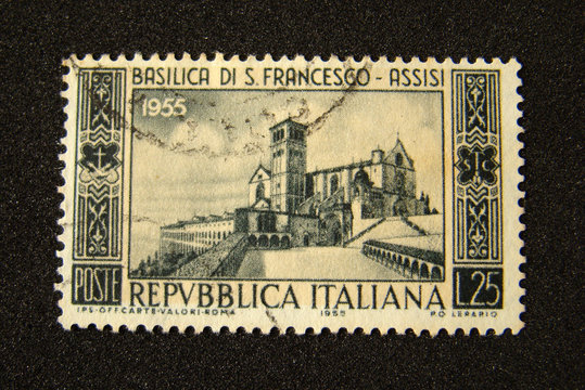 Italy postage stamp on black background.