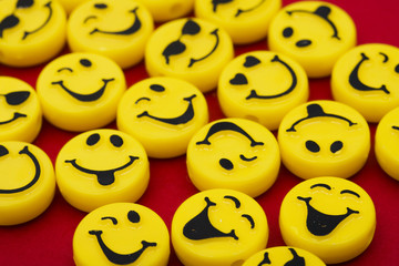 Happy faces on red background, smiling background