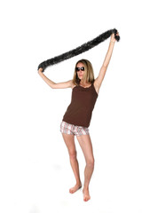 teen in sunglasses lifting scarf over head