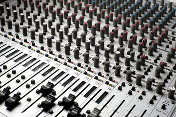 Obraz premium Audio recording equipment or soundboard background