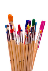 A group of multi-color painbrushes on a white background