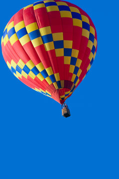 A hot air balloon in front of a blue sky with copy space
