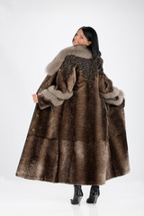 Young attractive woman in furcoat