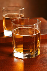 Transparent glass with juice, standing on table