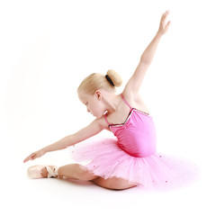 Young ballerina dancer over a white background