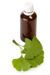 Fläschchen mit Medizin und Gingkoblättern