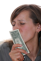 happy woman kissing a pack of money