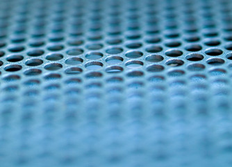 Macro picture of a metallic grid blue tinted