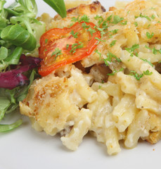 Freshly baked macaroni cheese with side salad