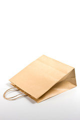 Paper shopping bag on white background.