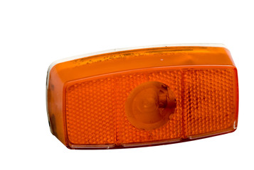 An orange blinker light isolated on white