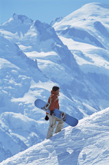 Naklejka na ściany i meble Young man snowboarding