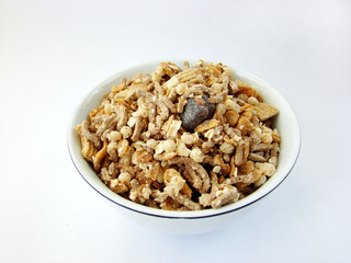 Cup of cereals on white background.