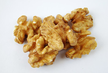 Some walnuts on white background.