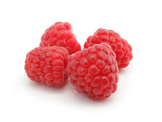 three raspberry berries isolated on white background