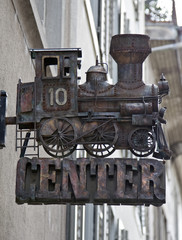 Nostalgic steam engine model against the building
