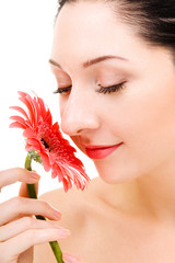 Young woman with gerber flower