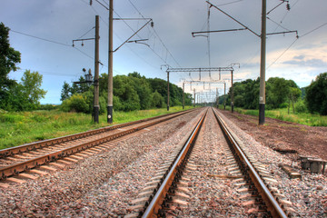 Fototapeta na wymiar Railway track leading far onward