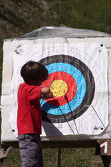 child retrieving arrow