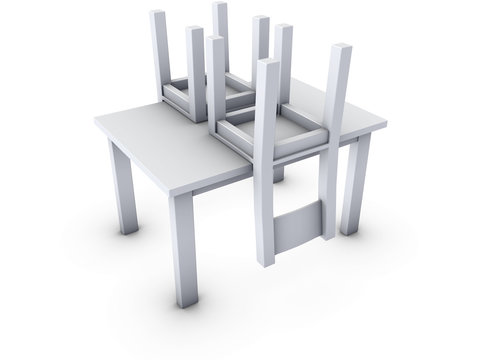 An isolated upside down chairs on table white background