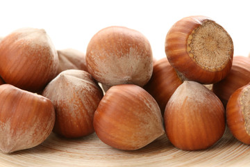 close-ups of hazelnuts on wooden table
