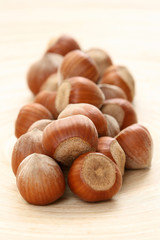close-ups of hazelnuts on wooden table