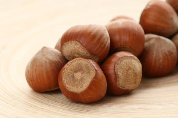 close-ups of hazelnuts on wooden table