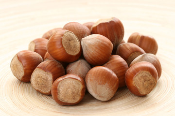 close-ups of hazelnuts on wooden table