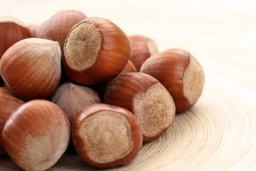 close-ups of hazelnuts on wooden table