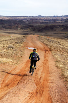 One mountain biker on rural road
