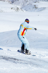 Fototapeta na wymiar Snowboard girl downhill