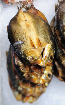 Stack of Manx kippers -- smoked herring in a fishmonger's