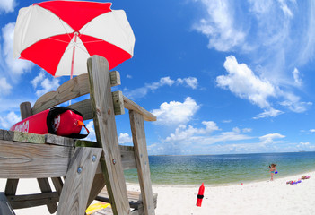 Lifeguard stand and umbrella at beach - 8959821
