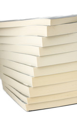 pile of paperback books on white background