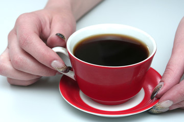 The  cup with fragrant coffee costs on a table