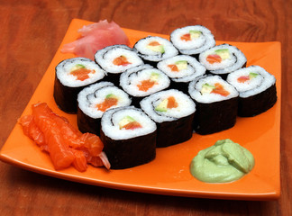sake avocado maki sushi on orange tray, wasabi, ginger
