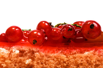 Red currant on a celebratory pie on a white background