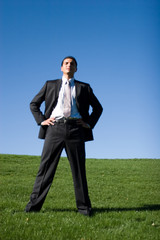 Confident businessman in dark suit.