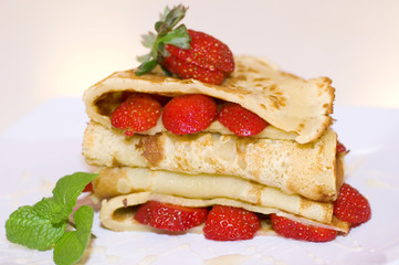 Delicious strawberries pancake on plate