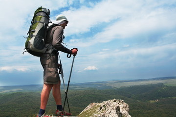 Male stand on the rock
