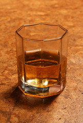 Transparent glass with juice, standing on table