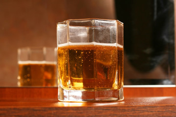 Transparent glass with juice, standing on table